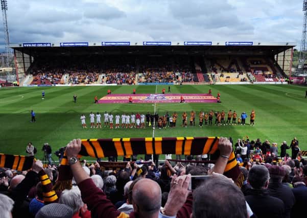 Players line up at Valley Parade for the minutes silence to mark the 30th anniversary of the Bradford City fire (Picture: Jonathan Gawthorpe).