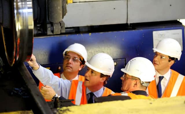 Prime Minister David Cameron (2nd left) with Chancellor George Osborne(right)