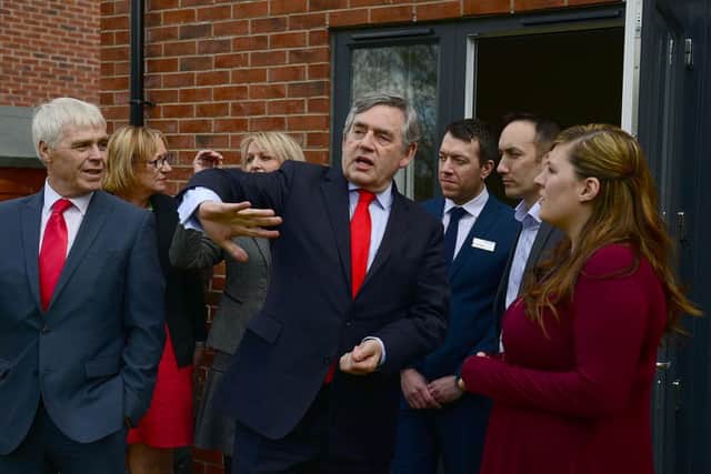 Gordon Brown with labour candidate Harry Harpin and home owner Anne Battersby during his visit to the Shirecliffe area of Sheffield. Picture: Scott Merrylees