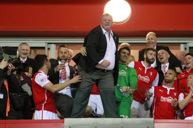 Steve Evans celebrates another year in the Championship -Pic by: Richard Parkes