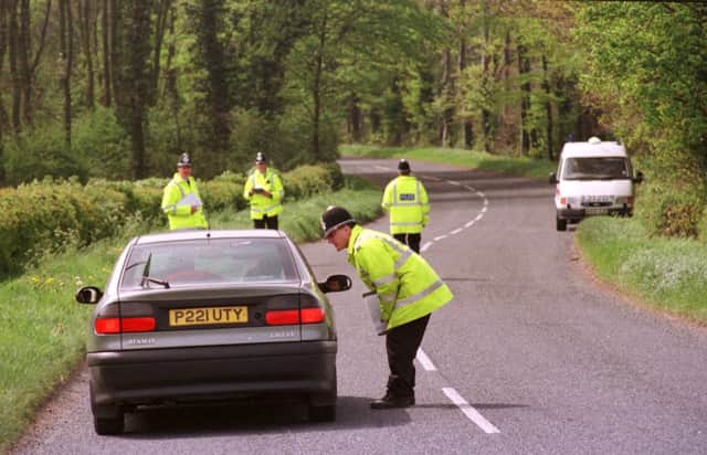 Police stop motorists on the road bewtween Norton and Stamford Bridge in an attempt to get clues leading to the identity of the mother of the baby found nearby in 1999. ©  Tony Bartholomew