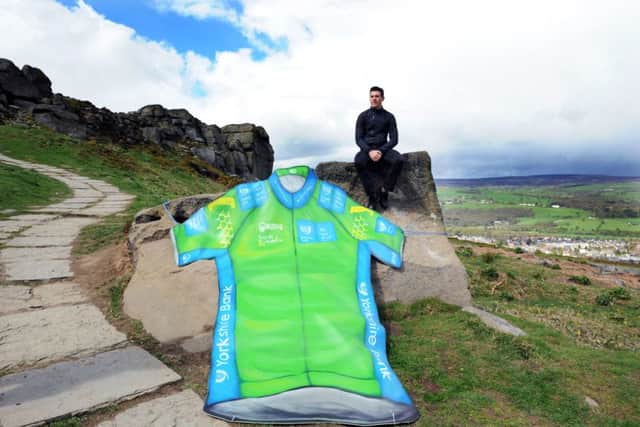 Ben Swift with the giant-sized jersey at Ilkleys Cow and Calf Rocks.