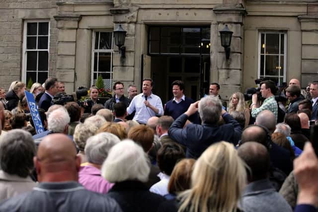 Prime Minister David Cameron speaks to the crowd during a walkabout in the centre of Wetherby on Thursday morning