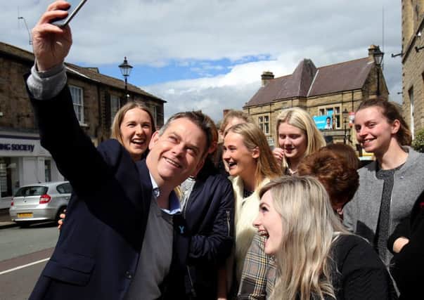 Conservative candidate for Selby and Ainsty Nigel Adams takes a selfie with members of the public