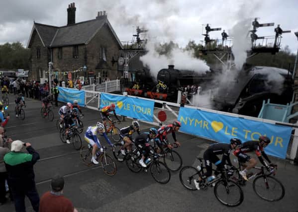 The peloton crosses the North Yorkshire Moors Railway line at Grosmont crossing during the Tour de Yorkshire between Bridlington and Scarborough. (Picture: Tim Goode/PA Wire)