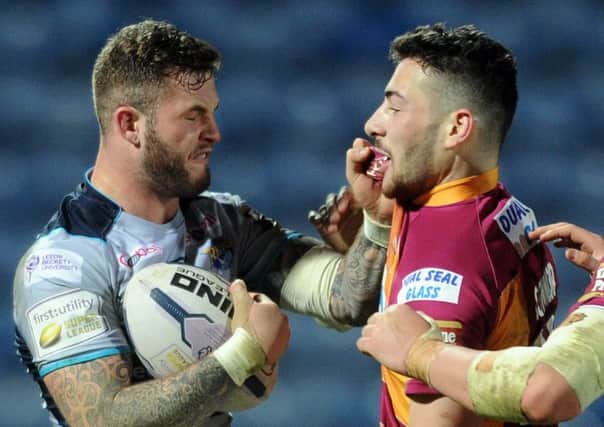 Zak Hardaker and Jake Connor square up late in the game between Leeds Rhinos and Huddersfield Giants. (Picture: Steve Riding).