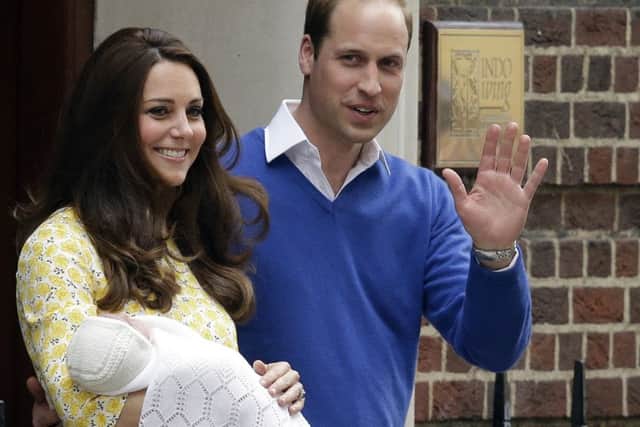 The Duke and Duchess of Cambridge and their newborn baby princess pose for the media as they leave St Mary's Hospital (AP)