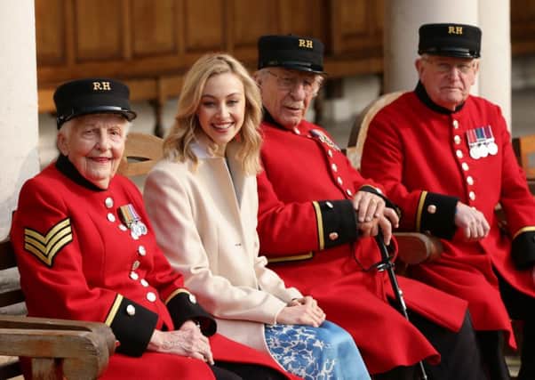 Sarah Gadon, star of the film A Royal Night Out, with Chelsea Pensioners.