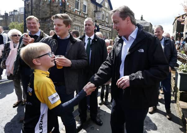 Prime Minister David Cameron meets members of the public during the General Election campaign trail in Addingham in West Yorkshire.  Pic: Lynne Cameron/PA Wire