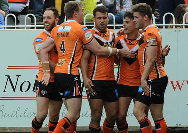 Castleford players celebrate a try