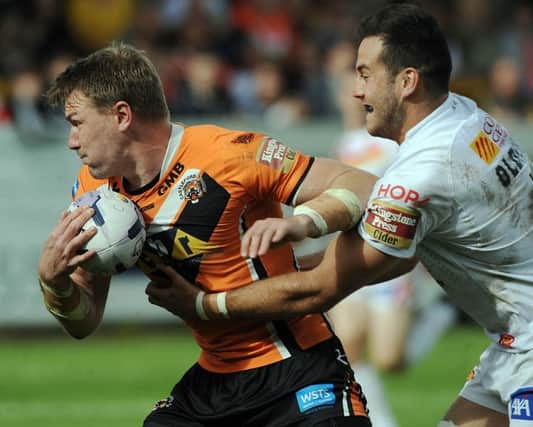 Castleford's Michael Shenton gets away from Catalans Michael Oldfield. Picture: Dave Williams.
