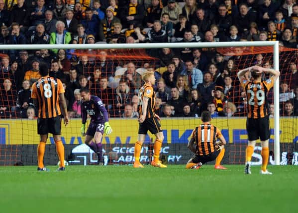 Hull City players react with dismay after Arsenal had scored their second goal on their way to a 3-1 Premier League victory at KC Stadium last night (Picture: Simon Hulme).