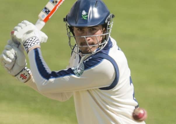 Yorkshire's Will Rhodes hits out against Warwickshire.