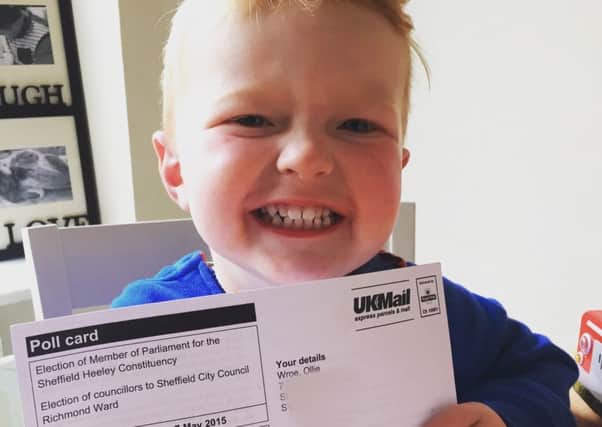 Ollie Wroe, 2 with his polling card.  Picture: Ross Parry Agency