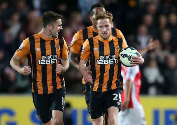 Hull City's Stephen Quinn (right) celebrates scoring his sides opening goal during the Barclays Premier League match at the KC Stadium, Hull.