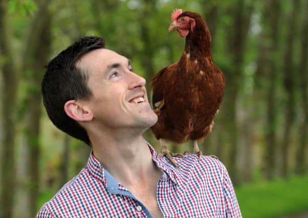Roy Allinson with one of his hens at Southwick Farm, Finghall near Bedale.