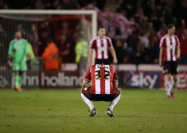 The despair of Steve Davies and his Sheffield United team-mates is evident after Nathan Byrne had scored a stoppage-time winner for Swindon Town in the sides League One play-off semi-final first leg at Bramall Lane last night (Picture: Martyn Harrison).