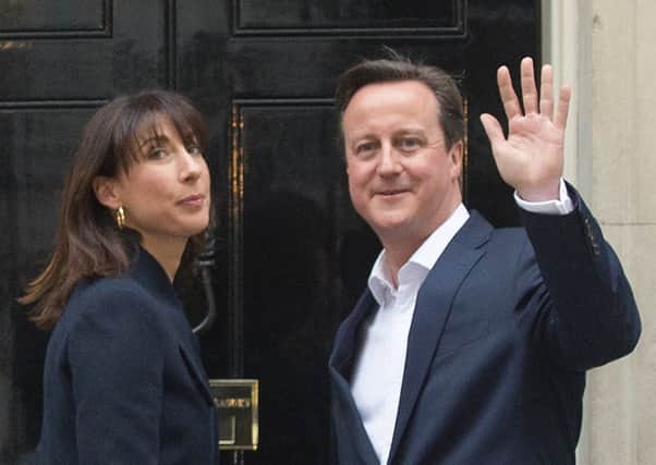 Prime Minister David Cameron and wife Samantha arrive back at 10 Downing Street this morning