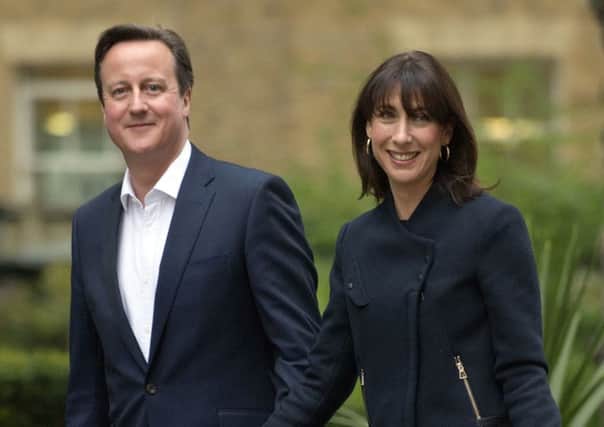 Prime Minister David Cameron and wife Samantha arrive at 10 Downing Street this morning. Picture: Anthony Devlin/PA Wire