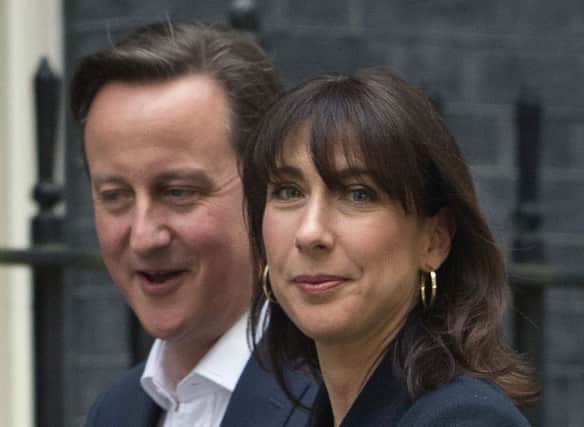 David Cameron and wife Samantha arrive at 10 Downing Street