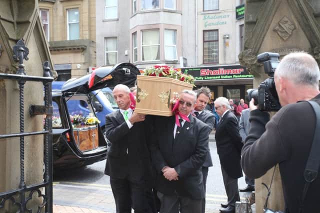 The coffin of Keith Harris is carried into Sacred Heart RC Church in Blackpool