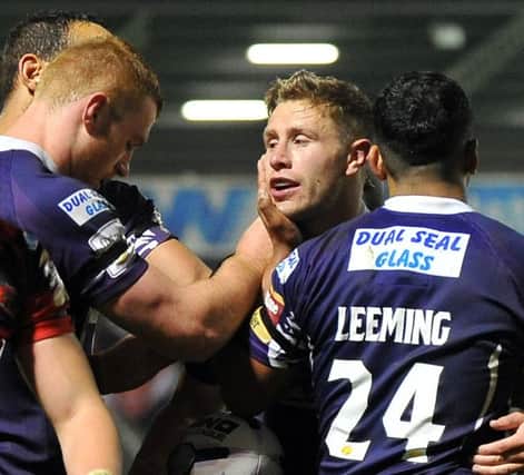 Huddersfield Giants' Kyle Wood celebrates scoring his side's third try against Salford