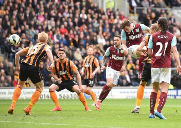 Burnley's Ashley Barnes heads on target during the Barclays Premier League match at the KC Stadium, Hull.