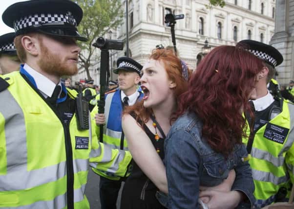 People pictured during an anti-austerity protest in central London