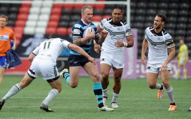 Leeds Rhinos' 
Jamie Peacock tries to find a way through the Widnes line. Picture: Steve Riding