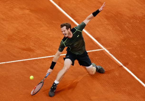Andy Murray stretches to make a return to Rafael Nadal during the final of the Madrid Open. Picture: AP/Daniel Ochoa