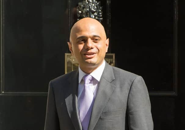 Sajid Javid arrives at 10 Downing Street in London and will become a full member of the Cabinet as he becomes the new Business Secretary.