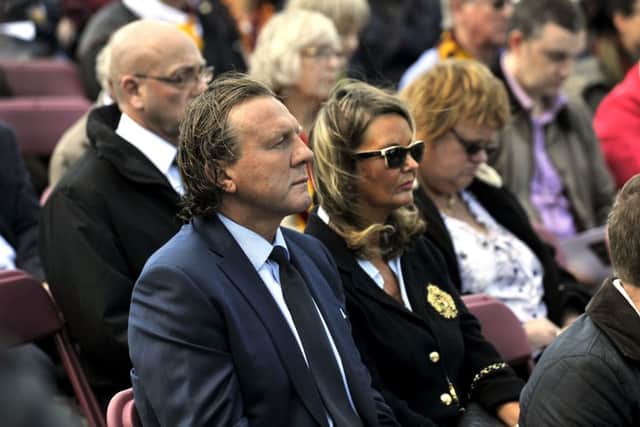 Mark Lawn, Phil Parkinson, David Helm and 1,000 more at the 30th anniversary commemoration of the Bradford City fire in the city's Centenary Square.  Picture: Bruce Rollinson