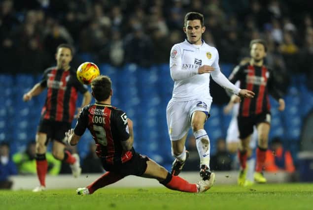 Lewis Cook avoids a challenge from Steve Cook.
Leeds United v Bournemouth.  SkyBet Championship.  20 January 2015.  Picture Bruce Rollinson