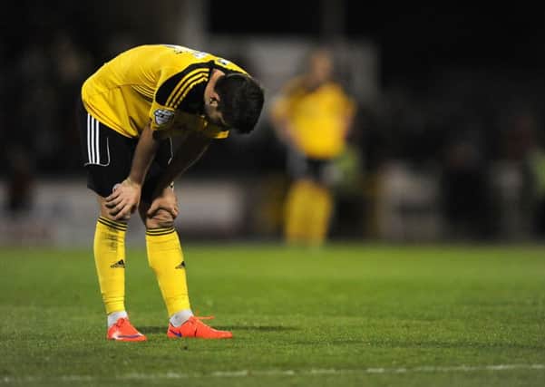 Sheffield United's Robert Harris stands dejected.