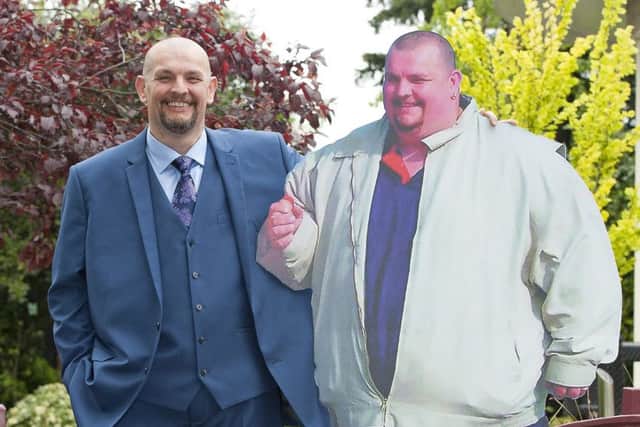 Biscuit factory worker Gary Marsden, 47, during a photocall in central London with a cardboard cutout of his former self, where he was named as Slimming World's Greatest Loser dropped from 37 stone to 18 stone 2015. (PA Wire)