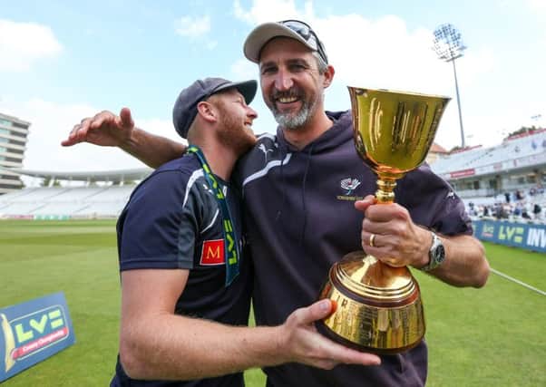 Yorkshire captain Andrew Gale and Jason Gillespie celebratelast year's Championship success.
