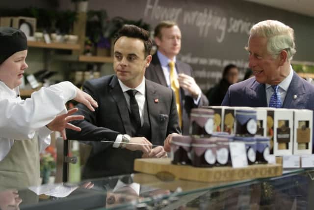 The Prince of Wales  talks to a Make your Mark Prince's Trust participant at work with Ant McPartlin during a visit to Marks and Spencer's Marble Arch branch in London.