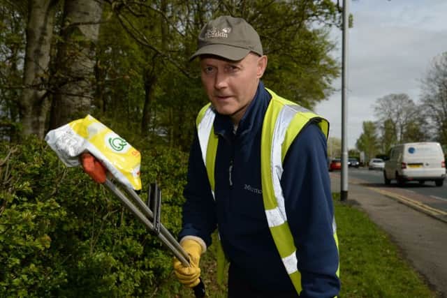 Jeff Yates, coordinator of Litter Free Guiseley, picks litter from the roadside in Guisley. Picture: Anna Gowthorpe