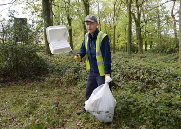 Jeff Yates, coordinator of Litter Free Guiseley, picks litter from woodland in Guisley. Picture: Anna Gowthorpe