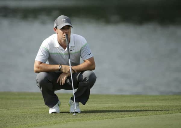 Rory McIlroy, of Northern Ireland, waits to putt on the 16th hole during the third round of the Wells Fargo Championship golf tournament at Quail Hollow Club in Charlotte. (AP Photo/Chuck Burton)