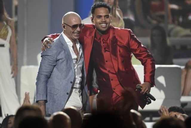 Pitbull, left, and Chris Brown perform at the Billboard Music Awards at the MGM Grand Garden Arena