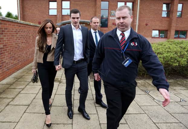 England footballer Adam Johnson and his partner Stacey Flounders leave Peterlee Magistrates' Court in County Durham