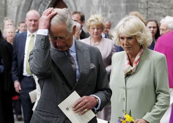 The Prince of Wales and the Duchess of Cornwall during a tree planting ceremony after a service of peace and reconciliation at St. Columba's Church in Drumcliffe