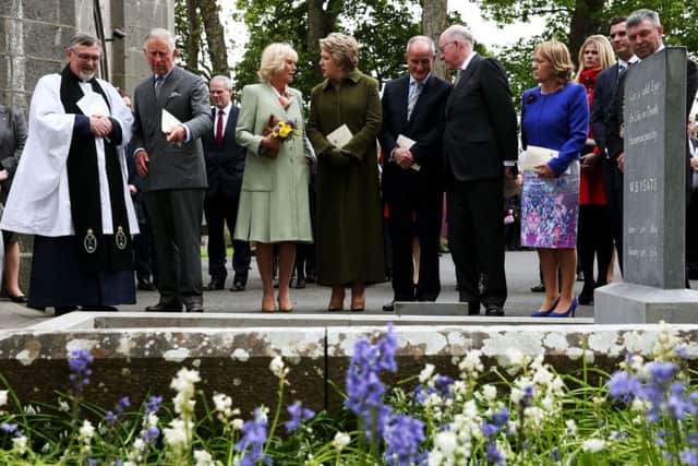 The Very Rev. Arfon Williams, the Prince of Wales and the Duchess of Cornwall, Former President of Ireland Mary McAleese, Martin McAleese, and Minister of Foreign Affairs Charlie Flanagan at the final resting place of W.B. Yeats