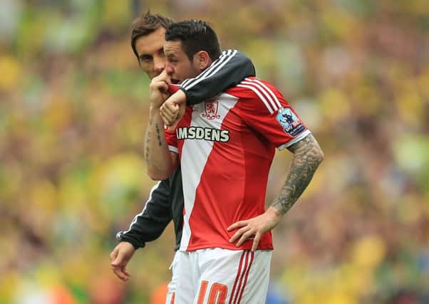 Middlesbroughs Lee Tomlin is consoled by team-mate Dean Whitehead after their Championship Play-off Final defeat to Norwich City at Wembley Stadium (Picture: Mike Egerton/PA Wire).