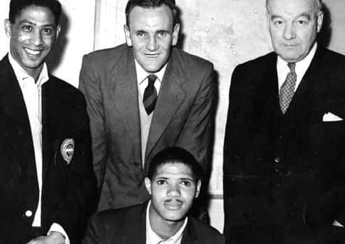 Albert Johanneson signs for Leeds Utd. with Gerry Francis, and Don Revie.