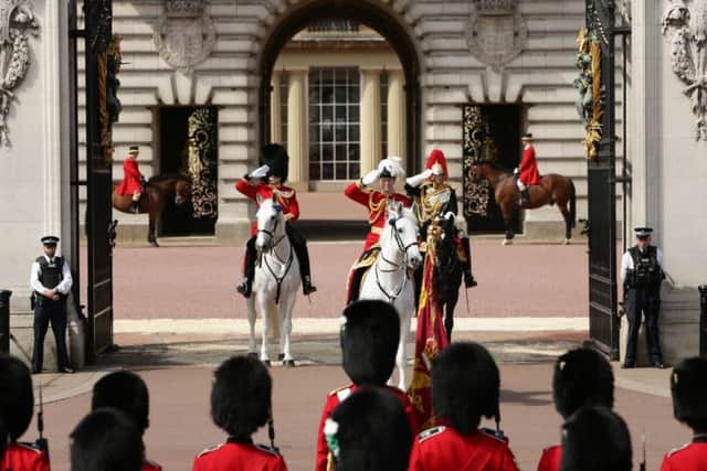 Soldiers in front of Buckingham Palace, London, ahead of the State Opening of Parliament.