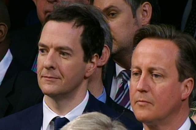 David Cameron and Chancellor George Osborne listen to the Queen's speech during the State Opening of Parliament