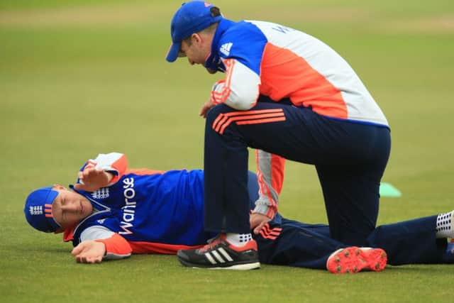 DOWN BUT NOT OUT: Joe Root goes through his stretches at Headingley yesterday.