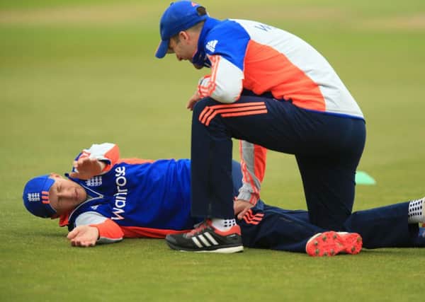DOWN BUT NOT OUT: Joe Root goes through his stretches at Headingley yesterday.